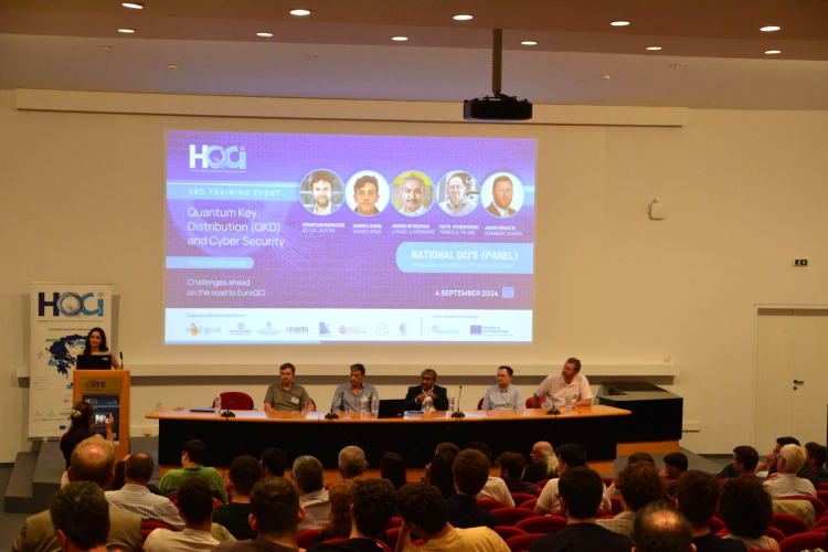 Panel with representatives of five (5) National Quantum Communication Infrastructures, namely Sebastian Ramacher, AIT Austrian Institute of Technology representative of QCI-Cat (Austria), Andrea Gorni, ICFO, Technical Coordinator of the EuroQCI-Spain project (Spain), Dr. Junaid ur Rehman, Interdisciplinary Centre for Security, Reliability and Trust (SnT) at the University of Luxembourg, Lux4QCI (Luxembourg), Piotr Rydlichowski, PSNC Network Operation Center and Project Coordinator of Pionier-Q (Poland), Janos Mohacsi, R&D Officer at Governmental Information-Technology Development Agency (KIFU) and coordinator of QCI Hungary (Hungary), panel moderator Dr. Evangelia Athanasaki, Deputy Head of the European and International Infrastructure Projects Directorate of GRNET.